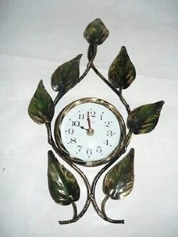 orologio-da-parete-al-quarzo-in-ferro-battuto-foglie.jpg