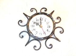 orologio-da-parete-con-movimento-al-quarzo-in-ferro-battuto-con-decoro-in-ferro655.jpg