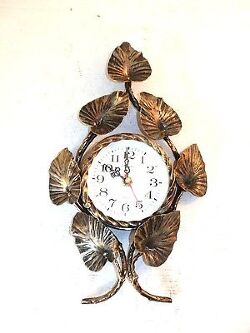 orologio-da-parete-con-movimento-al-quarzo-in-ferro-battuto-con-foglie-oro.jpg