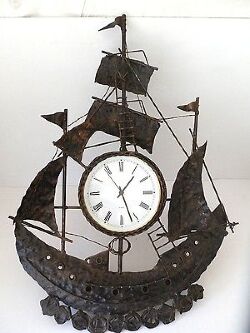 orologio-da-parete-in-ferro-battuto-veliero-nave-barca-ramato-dorato-nero.jpg